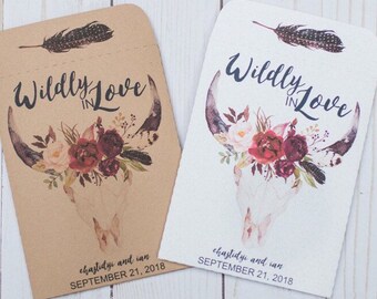 May include: Two white and brown paper envelopes with a floral skull design and the text "Wildly in Love" on each. The envelopes also include the names "chastidyi and ian" and the date "SEPTEMBER 21, 2018".