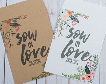 May include: Two white and brown paper favor bags with floral designs and the text "sow in love" with a wedding date.