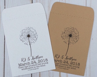 May include: Two white and brown paper envelopes with a dandelion design and the text "RJ & Kaitlynn March 24, 2018 Their lips brushed like young wildflowers in the wind. F. Scott Fitzgerald."