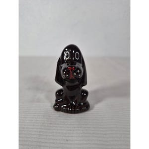 May include: A rustic wooden sign with the text "Welcome to our home" in white lettering. The sign features a distressed finish and a simple, inviting design, perfect for a front porch or entryway.