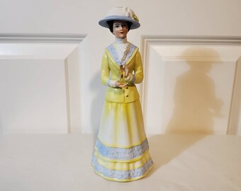 1980 Avon President&#39;s Club Mrs. P.F.E. Albee Award Figurine - yellow dress with perfume sample