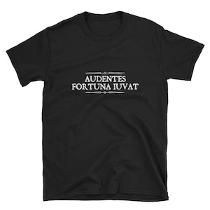 May include: Black t-shirt with the Latin phrase "Audentes Fortuna Iuvat" printed in white on the front. The phrase is surrounded by a decorative border.