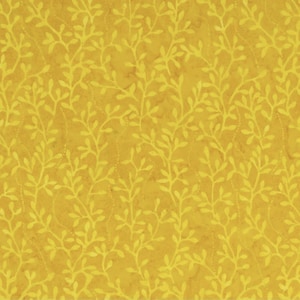 May include: Mustard yellow fabric with a repeating pattern of light yellow leafy vines. The fabric has a textured appearance and a ruler is at the bottom of the image, measuring up to 12 inches.