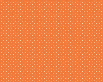 May include: Orange fabric with a white polka dot pattern. The fabric is a solid orange colour with small white dots evenly spaced throughout.