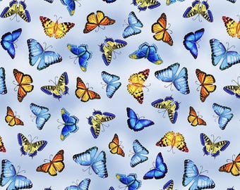 May include: A repeating pattern of colorful butterflies on a light blue background. The butterflies are in various sizes and orientations, with wings in shades of blue, yellow, and orange. The design is suitable for fabric or wallpaper.
