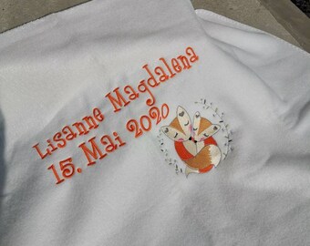 Cuddly baby blanket personalized with the birth dates name and cuddly toy
