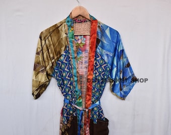May include: A colorful silk robe with a patchwork design. The robe has a brown, blue, orange, and green pattern. It has a belt and a pocket.