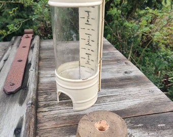 Very old rain water collector, used, rusty collector bottle