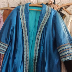 Old theater costume coat, blue with metal braid, vintage, distressed