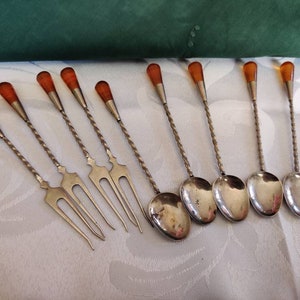 Set of tiny forks and spoons with amber or faux amber handle