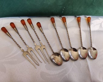 Set of tiny forks and spoons with amber or faux amber handle