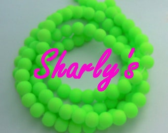 wire approximately 84 beads 10 mm satin glass neon green