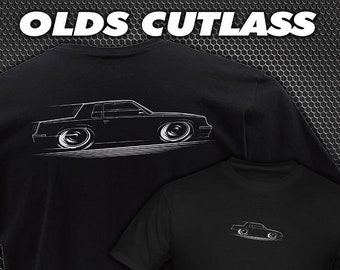 May include: Two black t-shirts with a white outline of a classic Oldsmobile Cutlass car. The text "OLDS CUTLASS" is at the top of the image.