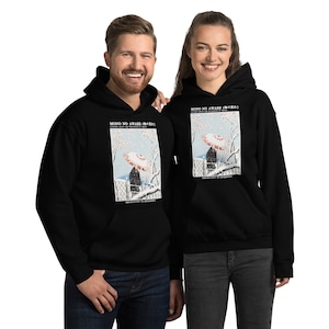 May include: Black hooded sweatshirts featuring a Japanese-inspired art print. The print includes a figure with an umbrella, cherry blossoms, and the text "MONO NO AWARE" and "SENSITIVITY TO IMPERMANENCE".