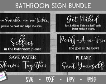 May include: A bundle of six rectangular black signs with a wood grain texture and white text. The signs feature humorous bathroom-themed phrases including If you Sprinkle when you Tinkle, Get Naked, No Selfies, Ready-Aim-Fire, Save Water, and Please Seat Yourself.