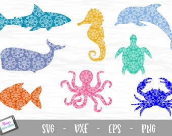 May include: A collection of eight sea creature silhouettes including a shark, seahorse, dolphin, whale, turtle, fish, octopus, and crab, each filled with a white floral mandala pattern. A small tablet displays the text Stacy's DIGITAL DESIGNS.