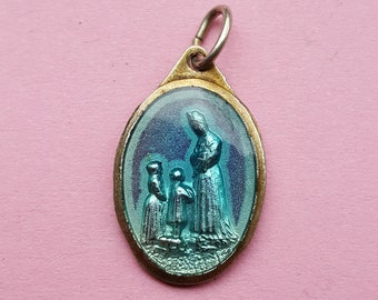 Religious antique French silvered blue enameled medal pendant of the grieving Virgin Holy Mary Our Lady, Notre Dame de la Salette.