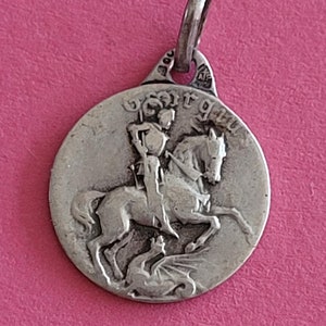 Beautiful antique sterling silver catholic medal pendant holy charm medallion of Saint George with dragon.