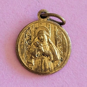 Antique religious French gold plated catholic medal pendant holy charm medallion of Saint Thérèse of Lisieux.