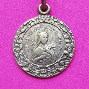 Beautiful religious antique French silver plated catholic medal pendant holy charm medallion of Saint Thérèse of Lisieux.