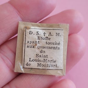 Holy card shrine relic reliquary, a blessed Sacrament of Saint Louis-Marie Grignion de Montfort and Holy Mary, containing a 3rd-class relic.