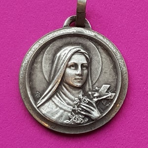 Stunning religious antique French silver plated catholic medal pendant holy charm medallion of Saint Thérèse of Lisieux.