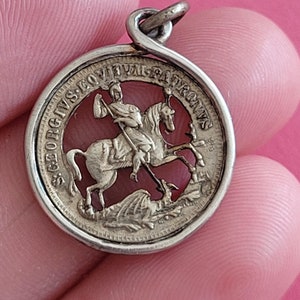 Stunning antique sterling silver catholic medal pendant holy charm medallion of Saint George with dragon.