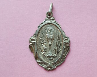 Antique Religious silvered Catholic 1st First Communion Chalice Medal Pendant Medal Lucky Charm from the 19th century.