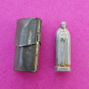 Religious vintage French catholic pocket shrine relic porta saint statue of Saint Mutien-Marie Wiaux of Malonne in a silver plated capsule.