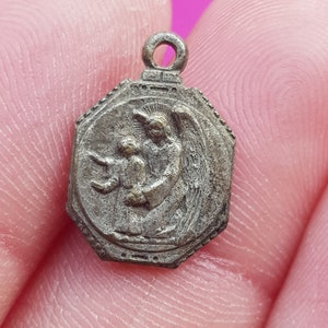 Beautiful precious religious antique silver plated catholic medal pendant, charm of a cherub, archangel, guardian angel.