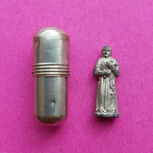 Religious vintage French catholic pocket shrine relic porta saint statue of Saint Gerard Majella, Sint Gerardus in a silvered capsule.