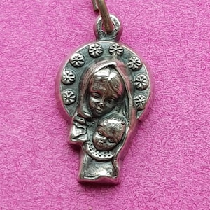 Precious religious vintage silver plated catholic  medal pendant medallion of Holy Mary Our Lady with child Jesus Christ.
