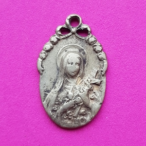 Stunning religious antique French silver plated catholic medal pendant holy charm medallion of Saint Thérèse of Lisieux.