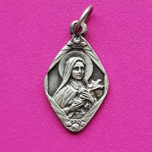 Beautiful religious antique French silver plated catholic medal pendant holy charm medallion of Saint Thérèse of Lisieux.
