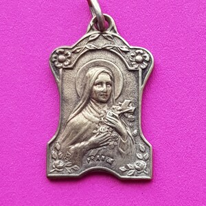 Beautiful religious antique French silver plated catholic medal pendant holy charm medallion of Saint Thérèse of Lisieux.