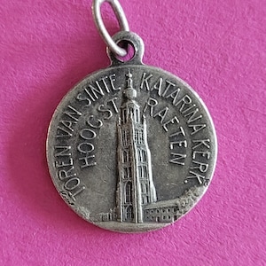 Religious antique silvered catholic medal pendant holy charm medallion of Holy Blood of Hoogstraeten a pilgrimage town in Belgium.