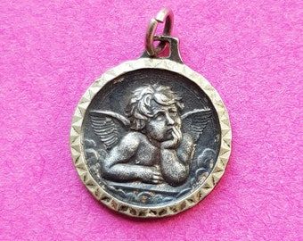 Religious antique French catholic silver plated medal pendant medallion holy charm of the famous Raphael cherub, Angel, guardian angel.