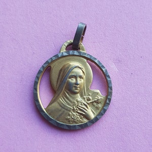 Antique religious French gold plated catholic medal pendant holy charm medallion of Saint Thérèse of Lisieux.
