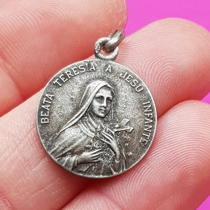 Beautiful religious antique French silver plated catholic medal pendant holy charm medallion of Saint Thérèse of Lisieux.