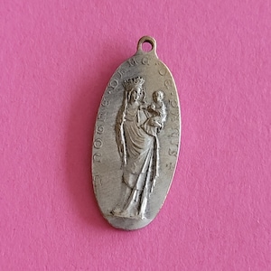 Religious antique French silvered catholic holy charm medal pendant of Holy Mary with Child Jesus, Notre Dame de Paris.
