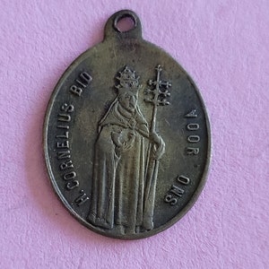 Religious antique bronze catholic Belgian medal pendant medaillon medallion holy charm of Saint Cornelius in Diechem, Diegem, Belgium.