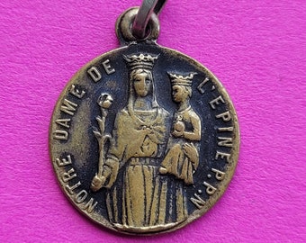 Beautiful religious antique medal charm pendant of Holy Virgin Mary of l'Epine with Child Jesus.