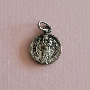 Religious antique French silvered catholic holy charm medal pendant of Holy Mary with Child Jesus, Notre Dame de Paris.