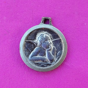Stunning precious religious antique silver catholic medal pendant charm of cherub, archangel, guardian angel.