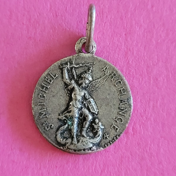 Religious Catholic silvered medal pendant holy charm of St. Michael the Archangel, St. Michel, Guardian Angel and Mont St Michel, France.