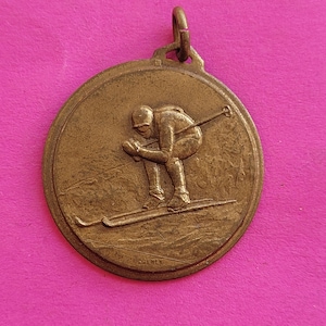 Beautiful bronze antique medal medallion charm pendant necklace of an alpinist, ski, skier, mountain, winter sports, cross country.