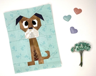 Patrón de bloques de edredón con piezas de papel de Doug el perro