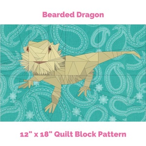 May include: A quilt block pattern featuring a beige bearded dragon on a turquoise background with a paisley pattern. The block is 12 inches by 18 inches.