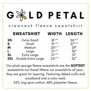 May include: A size chart for a crewneck fleece sweatshirt. The chart shows the sweatshirt size, width, and length in inches. The sweatshirt is made of 52% ring-spun cotton and 48% polyester fleece.