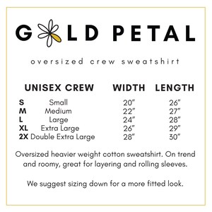 May include: Size chart for a unisex crew neck sweatshirt in sizes small, medium, large, extra large, and double extra large. The chart shows the width and length of each size in inches.